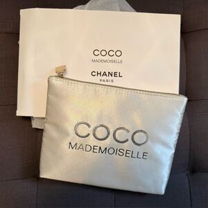 CHANEL Silver Pouch with Gold Charm